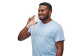 Happy african man drinking water from glass bottle Royalty Free Stock Photo