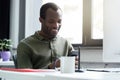 Happy african man looking at his mobile phone Royalty Free Stock Photo