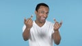 Happy African Man Showing Middle Fingers, Blue Background