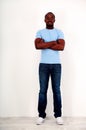 Happy african man standing with arms folded Royalty Free Stock Photo