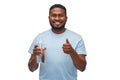 Happy african man with water in glass bottle Royalty Free Stock Photo