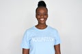 Happy african woman activist wear volunteer tshirt isolated on grey background.