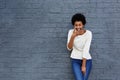 Happy african woman covering her mouth and laughing Royalty Free Stock Photo