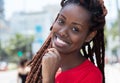 Happy african woman with dreadlocks in the city Royalty Free Stock Photo
