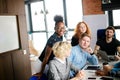 Happy African woman in glasses in leaning on chairs and listening Royalty Free Stock Photo