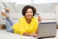 Happy african woman with laptop and credit card Royalty Free Stock Photo