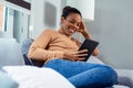 Happy African Woman Looking At Digital Tablet. Royalty Free Stock Photo