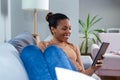 Happy African Woman Looking At Digital Tablet. Royalty Free Stock Photo