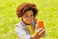 Happy african woman taking selfie with smartphone Royalty Free Stock Photo