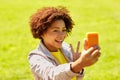 Happy african woman taking selfie with smartphone Royalty Free Stock Photo