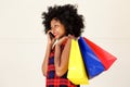 Happy african woman talking on phone with shopping bags Royalty Free Stock Photo