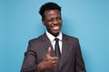 Happy african young businessman showing thumb up approving your choice. Royalty Free Stock Photo