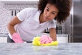 African Woman Cleaning Kitchen Counter Royalty Free Stock Photo