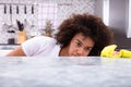 African Woman Cleaning Kitchen Counter Royalty Free Stock Photo