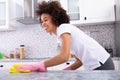 African Woman Cleaning Kitchen Counter Royalty Free Stock Photo