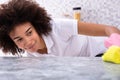 African Woman Cleaning Kitchen Counter Royalty Free Stock Photo