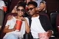 Happy afro american couple watching 3D movie Royalty Free Stock Photo