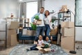 Afro american family posing among boxes at new house Royalty Free Stock Photo