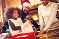 Happy Afro-American family opening Christmas presents Royalty Free Stock Photo