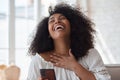 Happy afro black woman looking at mobile phone waving hand and greeting. Royalty Free Stock Photo