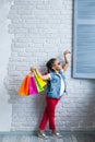 Happy afro girl with shopping bags Royalty Free Stock Photo