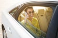 Happy afro woman talking on phone in car Royalty Free Stock Photo