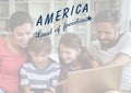 Happy american family looking at the digital tablet for the 4th of July Royalty Free Stock Photo