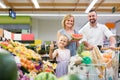 family shopping various fresh fruits in supermarket Royalty Free Stock Photo