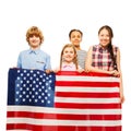 Happy American kids with the star-spangled banner