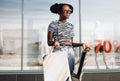 Happy American woman, with shopping bags shopping, fashionable woman enjoying shopping in the city on Black Friday Royalty Free Stock Photo