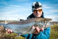 Happy angler with sea trout Royalty Free Stock Photo