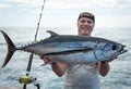 Happy angler with big tuna Royalty Free Stock Photo