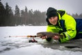 Happy angler with brown trout fishing trophy Royalty Free Stock Photo