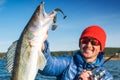 Happy angler holds Zander fish Royalty Free Stock Photo