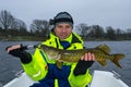 Happy angler with pike Royalty Free Stock Photo