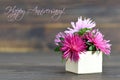 Happy Anniversary card with flowers arranged in gift box Royalty Free Stock Photo