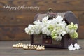 Happy Anniversary card. White lilac flowers in wooden chest Royalty Free Stock Photo