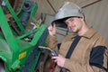 Happy apprentice welder at work in plant Royalty Free Stock Photo