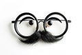 Happy april fool\'s day and funny pranks concept with a pair of comical glasses with bushy eyebrows and thick mustache