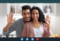 Happy arab couple making video call with laptop in kitchen interior, screenshot