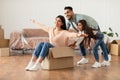 Happy arab family celebrating moving day in new apartment Royalty Free Stock Photo