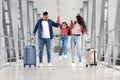 Happy Arab Family Of three Having Fun Together While Walking In Airport Royalty Free Stock Photo