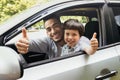 Happy Arab Father And Son Sitting In Car And Showing Thumbs Up Royalty Free Stock Photo