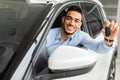 Happy arab man holding key from auto, buying car Royalty Free Stock Photo