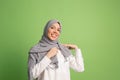 Happy arab woman in hijab. Portrait of smiling girl, posing at studio background