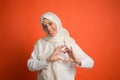 Happy arab woman in hijab. Portrait of smiling girl, posing at studio background Royalty Free Stock Photo