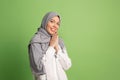 Happy arab woman in hijab. Portrait of smiling girl, posing at studio background