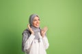 Happy arab woman in hijab. Portrait of smiling girl, posing at studio background