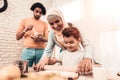 Happy Arabian Family Cooking Food in Kitchen.