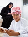 Happy Arabic child at home with his mother